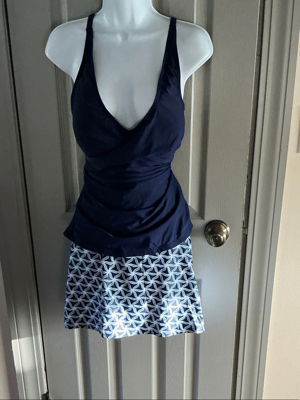 Navy Wrap-Style Tankini with Patterned Skirted Bottom.